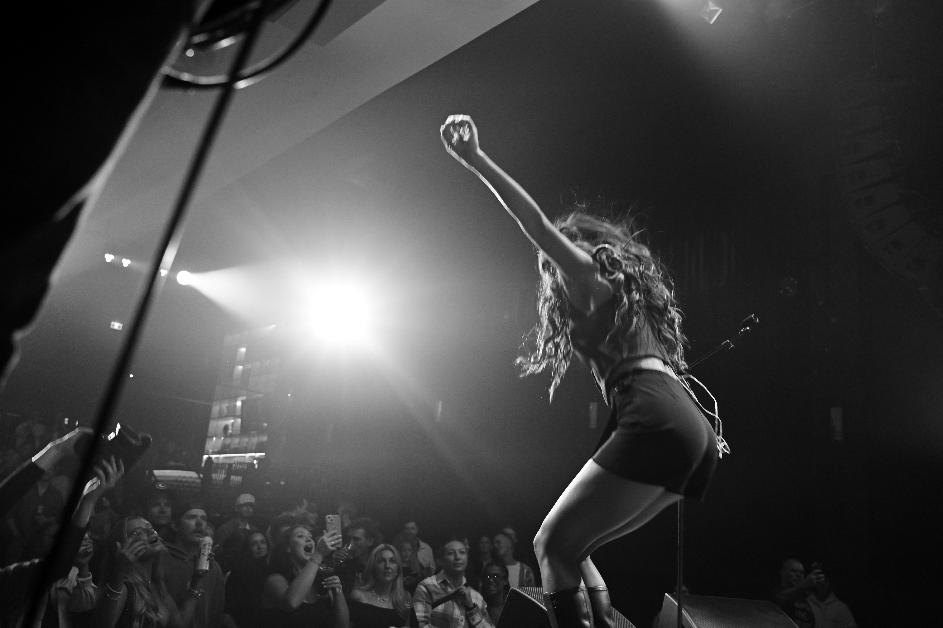 Singer performing under stage lights
